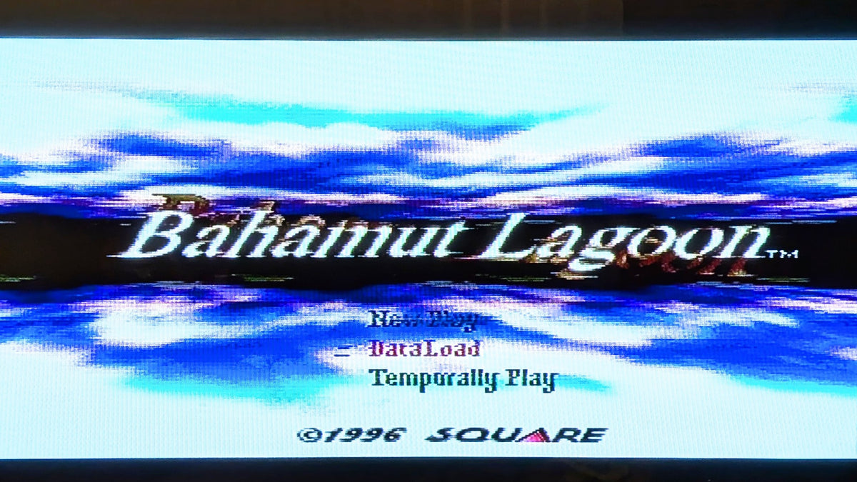 The video game title screen for Bahamut Lagoon, featuring blue and white water graphics with the title text and a Square copyright notice from 1996. Releasd by Nintendo for the Super Famicom.