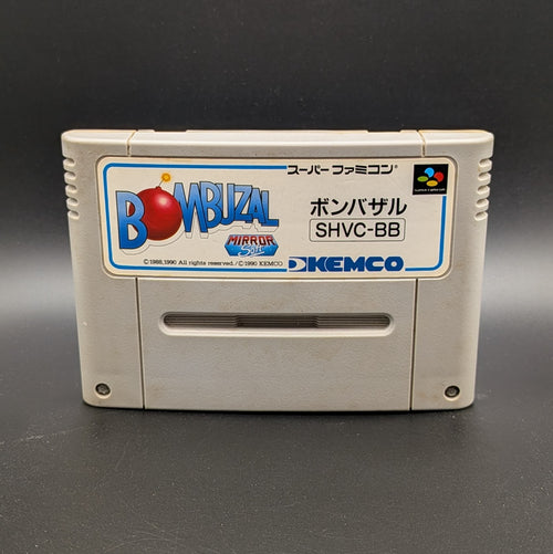 Bombuzal video game cartridge for Nintendo's Super Famicom (SFC) Entertainment System, shown standing up and facing forward on a dark grey background.