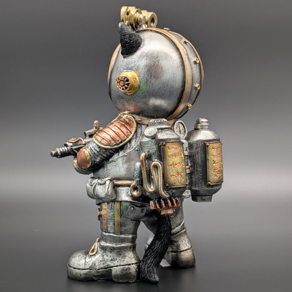 A detailed collectible figurine of a steampunk-style space suit character, featuring a metallic silver helmet, copper and bronze mechanical armor, and a black cat tail, set against a dark gray gradient background.