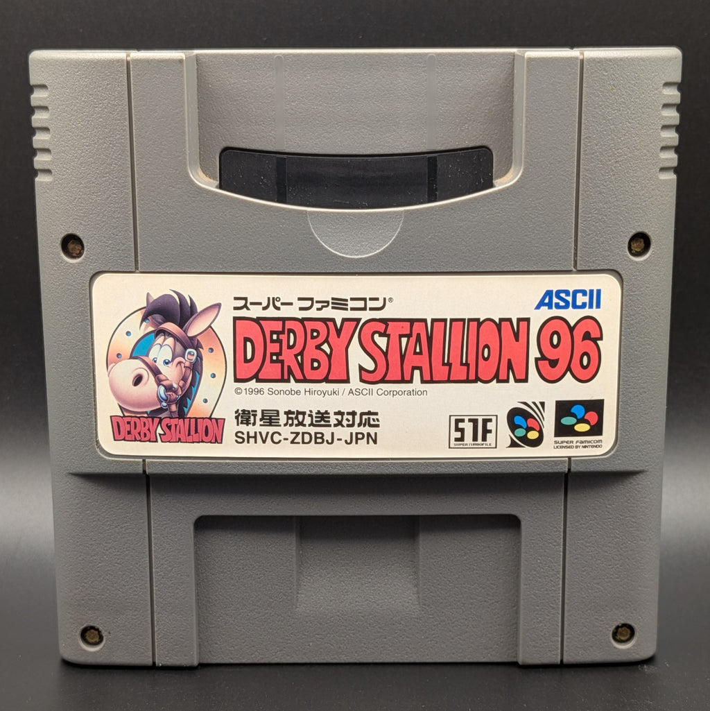 A close up of Derby Stallion 96' video game cartridge for Nintendo's Super Famicom (SFC) Entertainment System, shown standing up and facing forward on a dark grey background.

