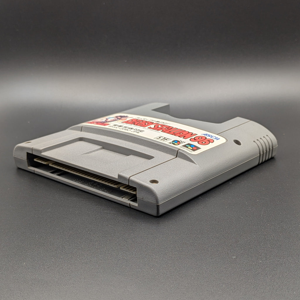 Derby Stallion 96 video game cartridge for Nintendo's Super Famicom (SFC) Entertainment System, shown laying on its back with the label facing upwards. Showing the right hand side and bottom slot. It sits on a dark grey background.