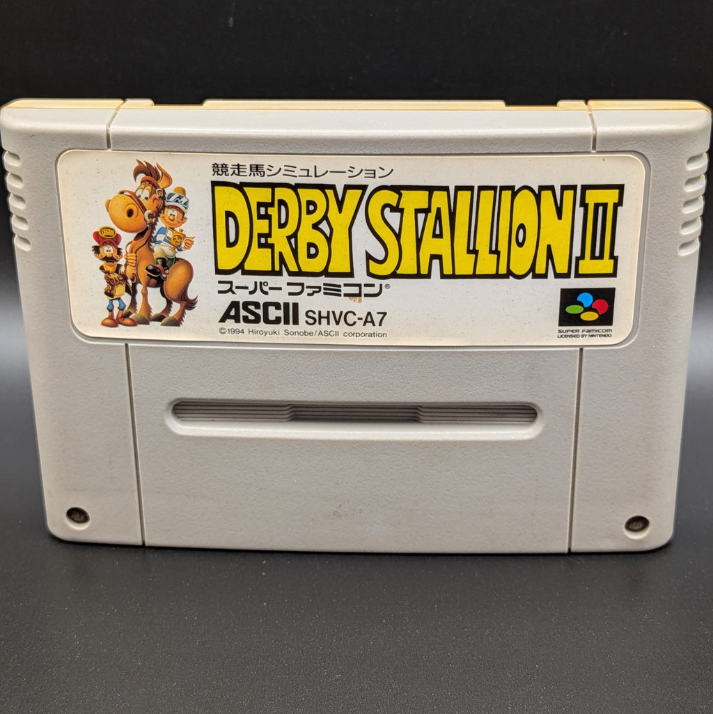 A close up of Derby Stallion 2 video game cartridge for Nintendo's Super Famicom (SFC) Entertainment System, shown standing up and facing forwards on a dark grey background.
