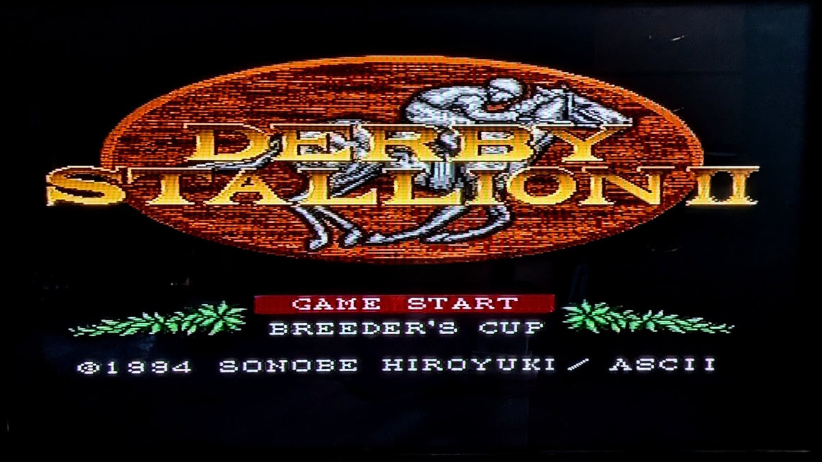 The game title screen for 'Derby Stallion II' with an oval wood-textured logo, gold lettering, a horse-and-rider graphic, and menu options including 'Game Start' and 'Breeder's Cup' on a black background. Super Famicom (SFC) game from Nintendo. This is to show the game is tested and working.