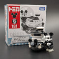 Takaoka Tomy Tomica Disney Mickey Mouse Steamboat Willie set, showing the box with number 181 and the toy figure of Mickey and his boat on a dark gray background.