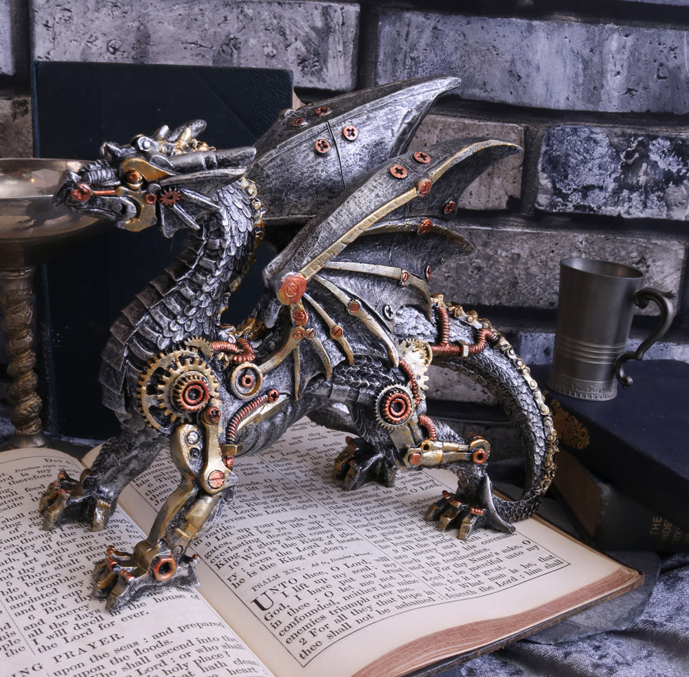 Steampunk dragon figurine on an open book with a stone wall background