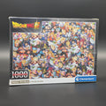 Dragon Ball Super 1000-piece jigsaw puzzle box by Clementoni, featuring a colourful collage of anime characters on a dark grey background.