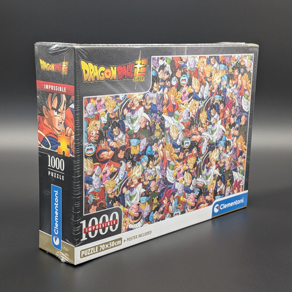 A sealed Clmenton Dragon Ball Super 1000-piece jigsaw puzzle box, showing the full illustrated puzzle artwork on the front and the spine details, photographed on a dark gray studio background.