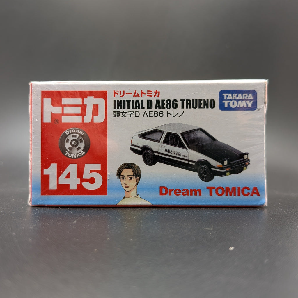 DreamTomica #145 AE86 Trueno from Intial D. Box facing forwards straight on, on a grey background.