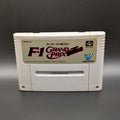 F-1 Grand Prix video game cartridge for Nintendo's Super Famicom (SFC) Entertainment System, shown standing up and facing forwards on a dark grey background.