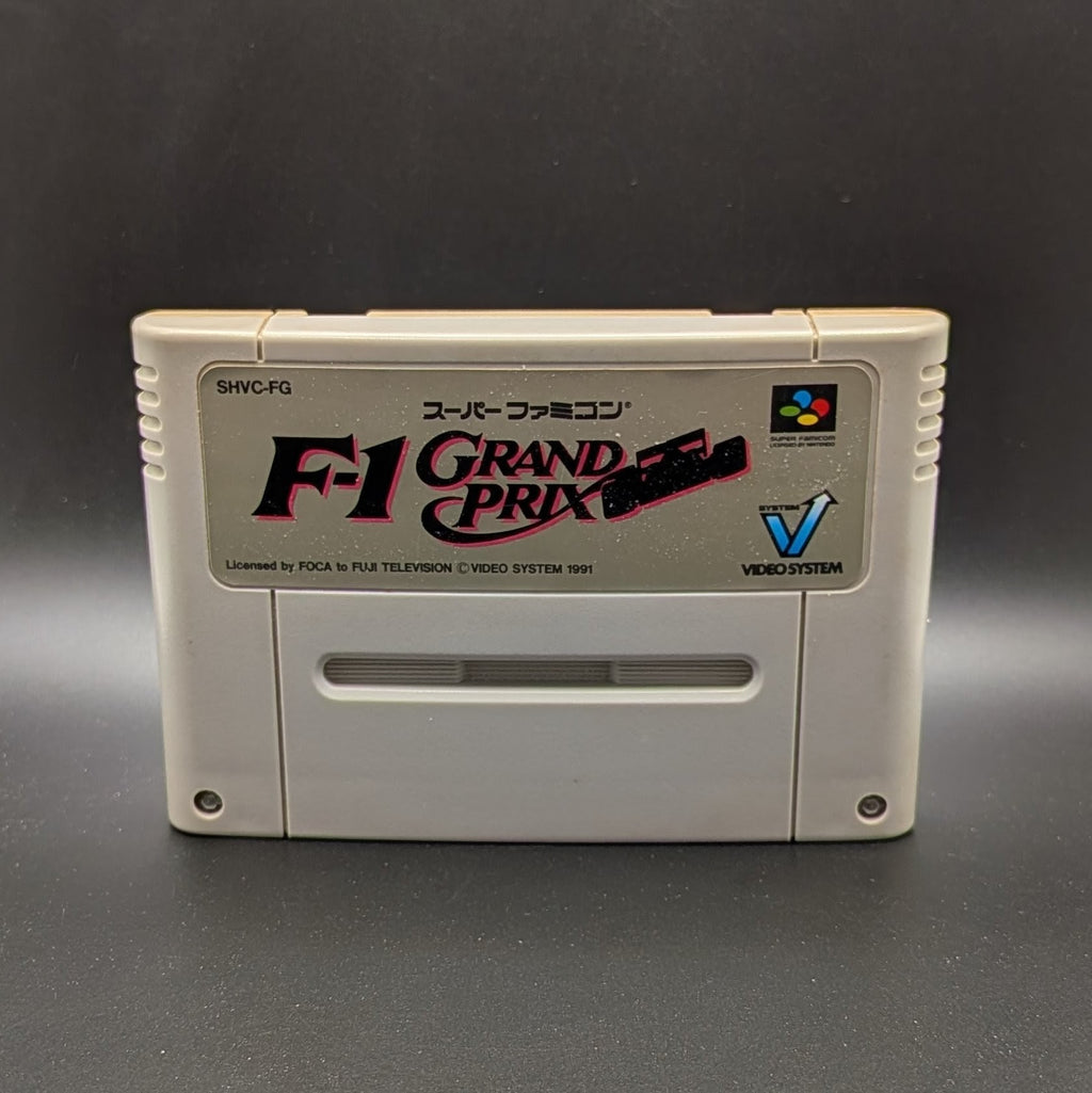 F-1 Grand Prix video game cartridge for Nintendo's Super Famicom (SFC) Entertainment System, shown standing up and facing forward on a dark grey background.
