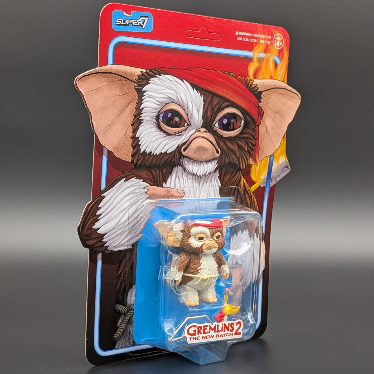 Gremlins 2 The New Batches 'Gizmo' action figure in its original Super7 blister card packaging, featuring a detailed character illustration of Gizmo on the backing card.