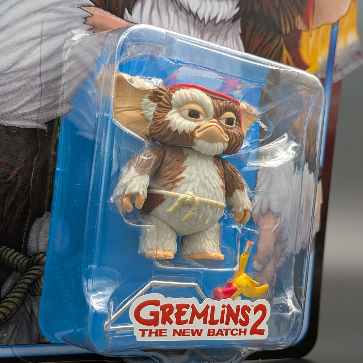 Gremlins 2: The New Batch action figure of Gizmo in its original blister packaging, featuring a brown and white furry character with a red hat.