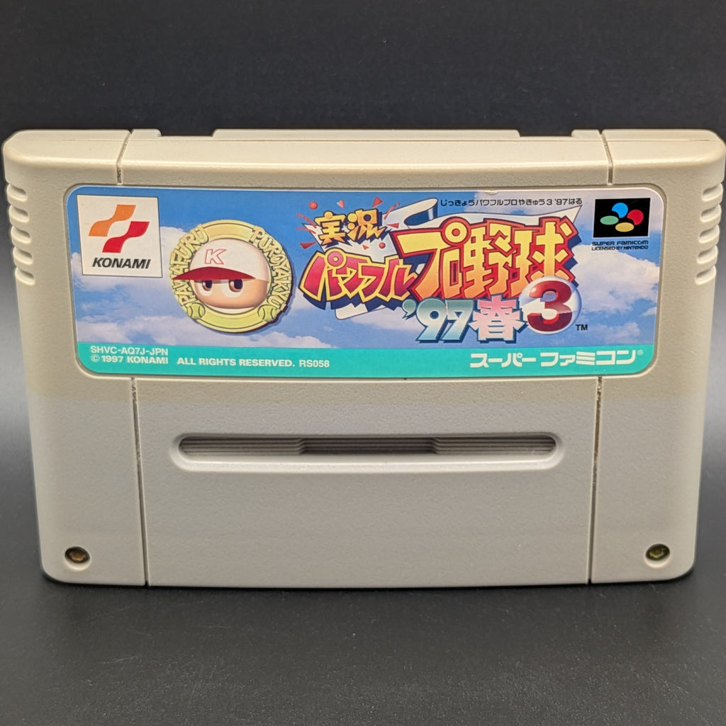 A close up ol a video game cartridge for Nintendo's Super Famicom (SFC) Entertainment System, shown standing up and facing forward on a dark grey background.
