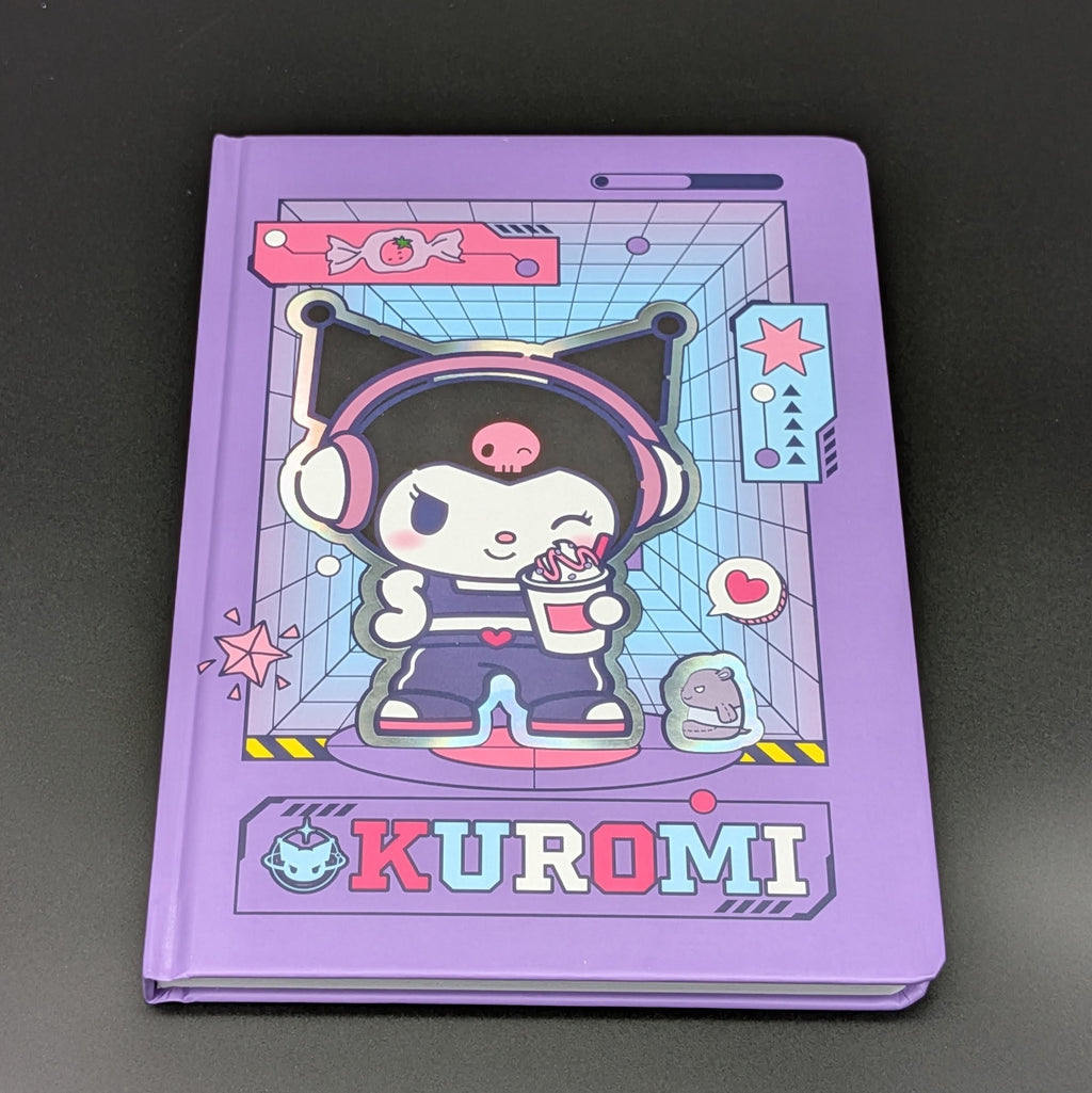 A purple Kuromi ruled notebook with a colourful cartoon cover illustration, photographed on a dark gray background. From the Sanrio POP range, printed by Blue Sky Studios.