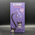Kuromi Mini Lamp retail packaging box, featuring a purple design with Kuromi character illustrations and a lamp graphic, photographed against a dark gray background.
