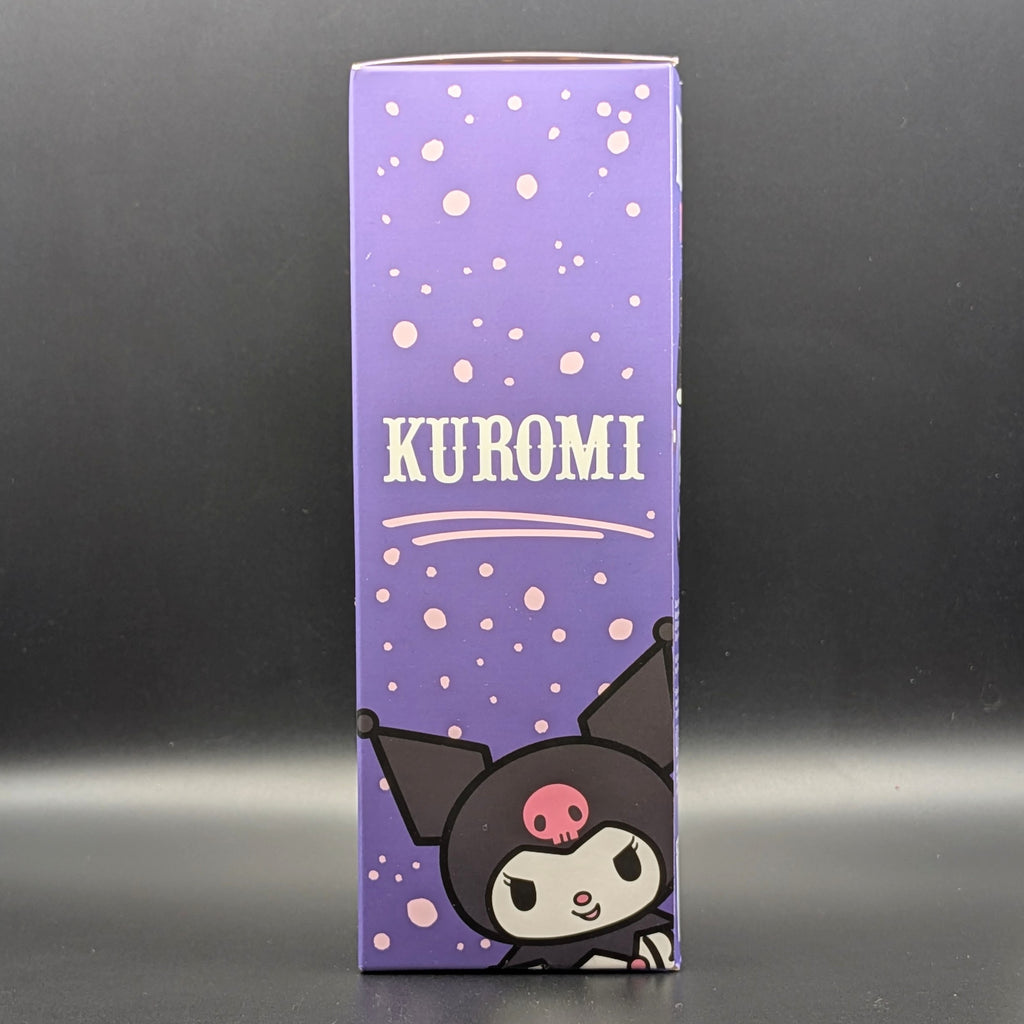 A tall purple product box featuring the name KUROMI in white text and an illustration of the character Kuromi at the bottom, photographed against a dark gray background.