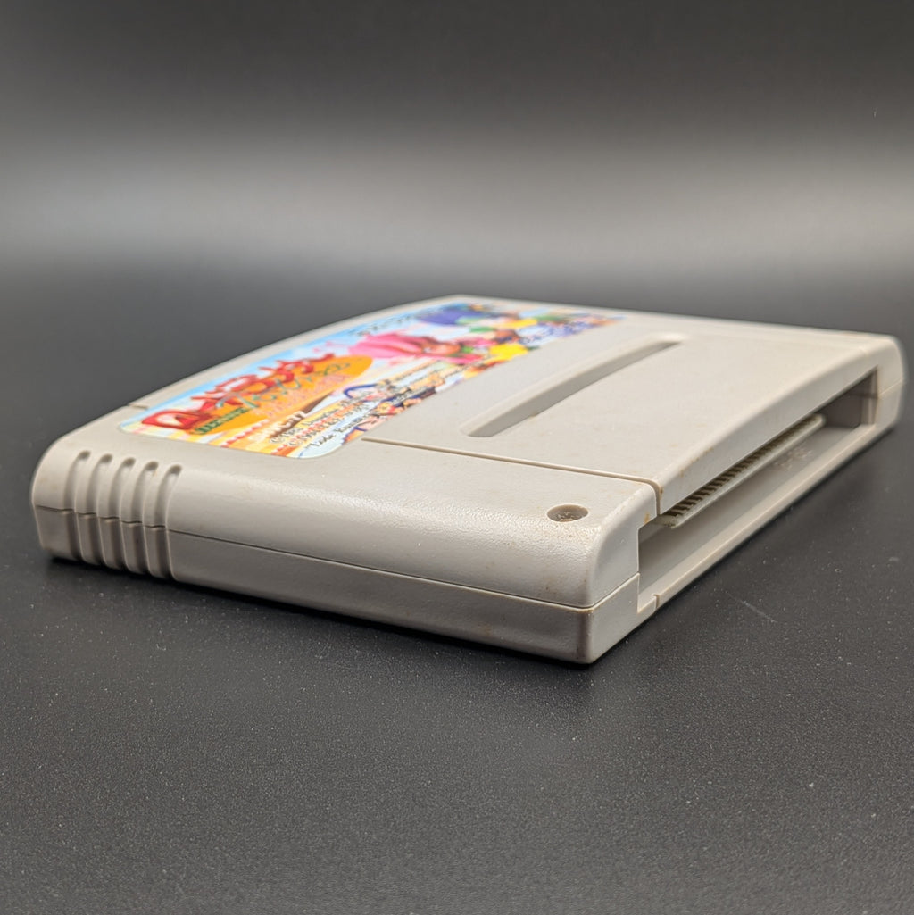 Lode Runner Twin : Justy to Liberty Daibouken video game cartridge for Nintendo's Super Famicom (SFC) Entertainment System, shown laying on its back with the label facing upwards. Showing the left hand side and bottom slot. It sits on a dark grey background