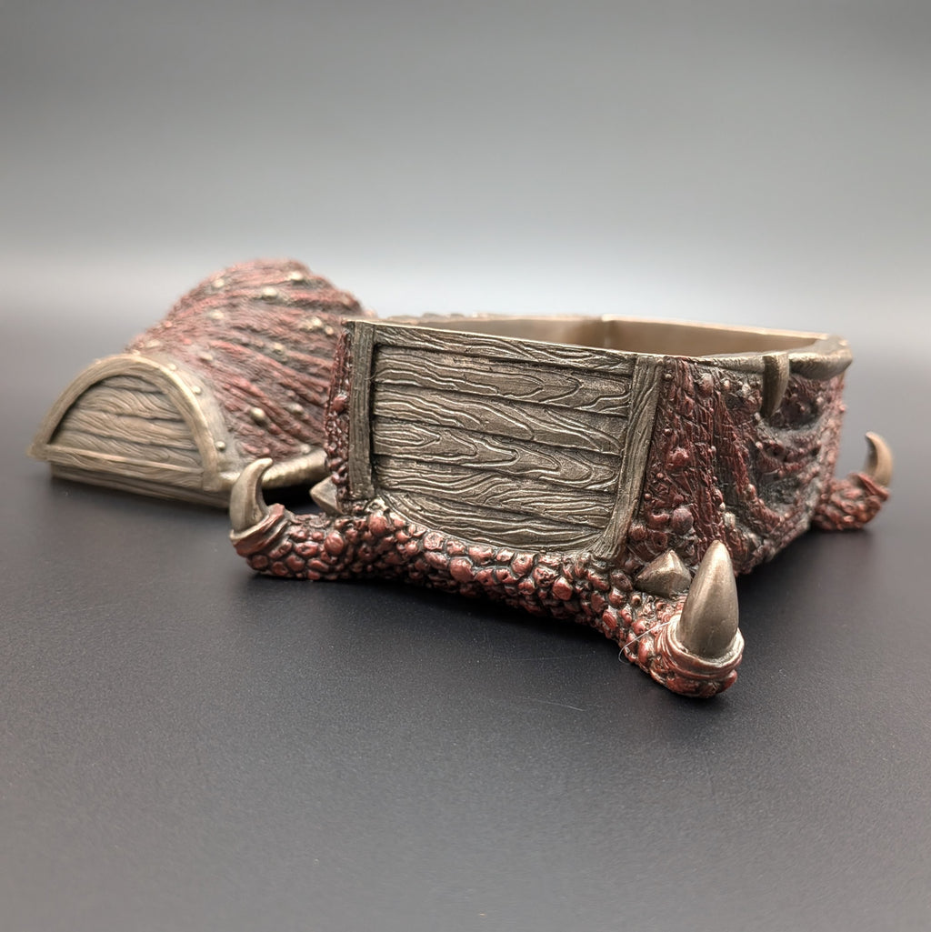 A fantasy-themed mimic chest, featuring textured scales in reddish-brown with a wood-grain pattern on the sides.