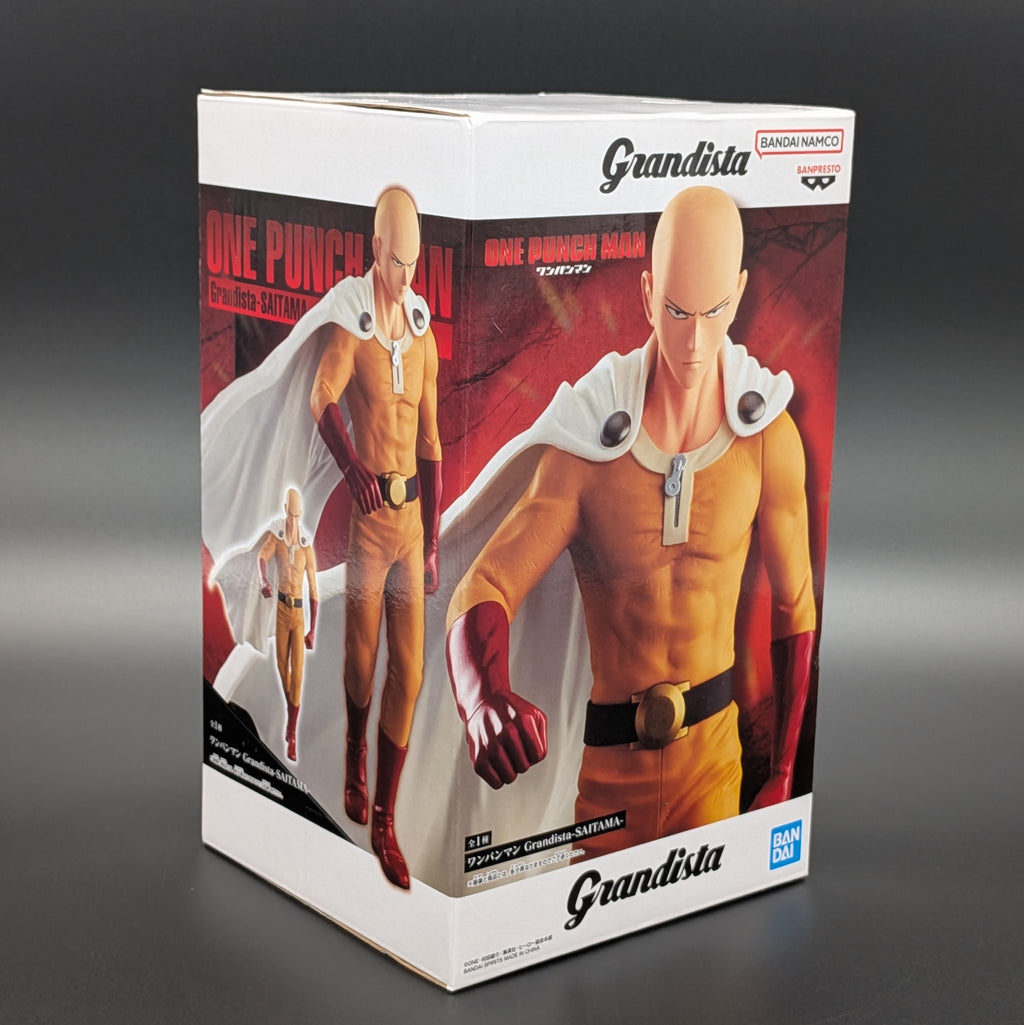 Bandai Namco Granddista One Punch Man Saitama 1/12 scale collectible figure  in box, featuring character artwork of Saitama in his signature orange and white outfit.
