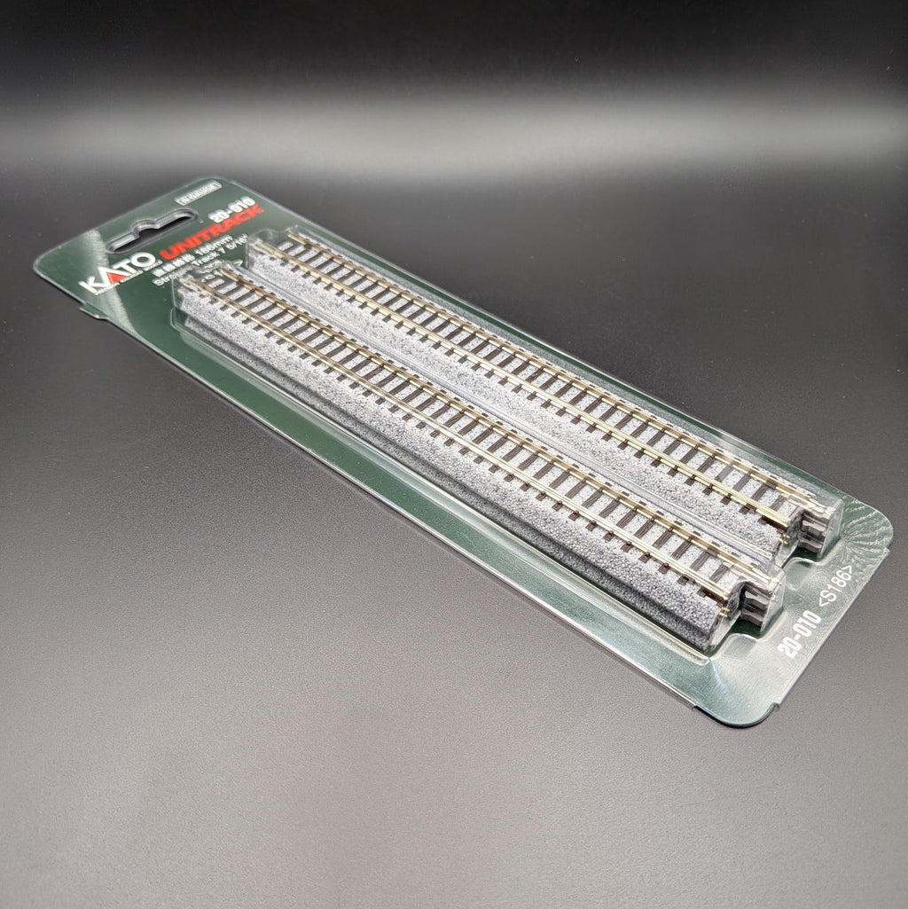 Kato Unitrack 20-010 S186 — Straight Track, N-gauge (Pack of 4). Item is shown laying down on a black background at a 3/4, view giving view of the sides of the track.