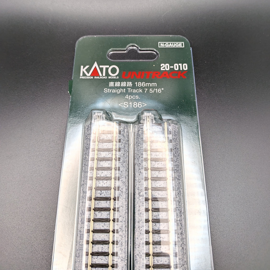 Kato Unitrack 20-010 S186 — Straight Track, N-gauge (Pack of 4). A close-up of the top half of the package so you see the Item information and parts of track through the clear outer packaging.