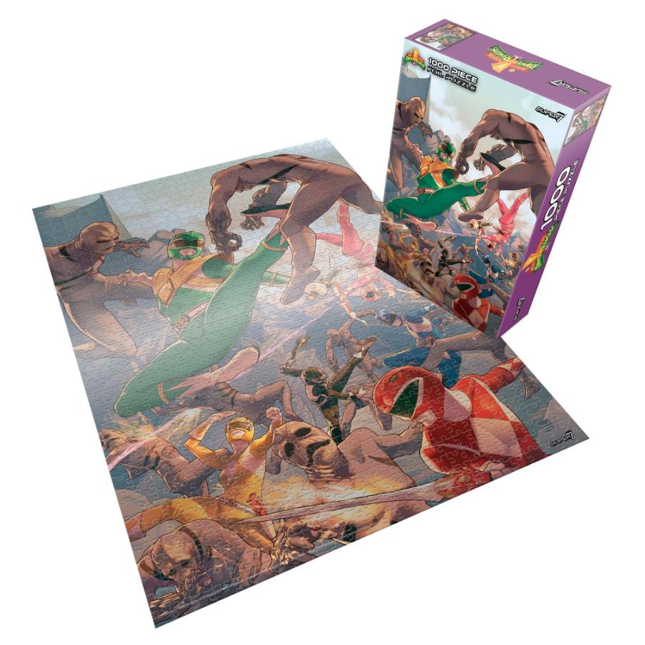 A completed jigsaw puzzle showing a colorful battle scene with Power Rangers-style characters, displayed next to its purple branded box on a white background.