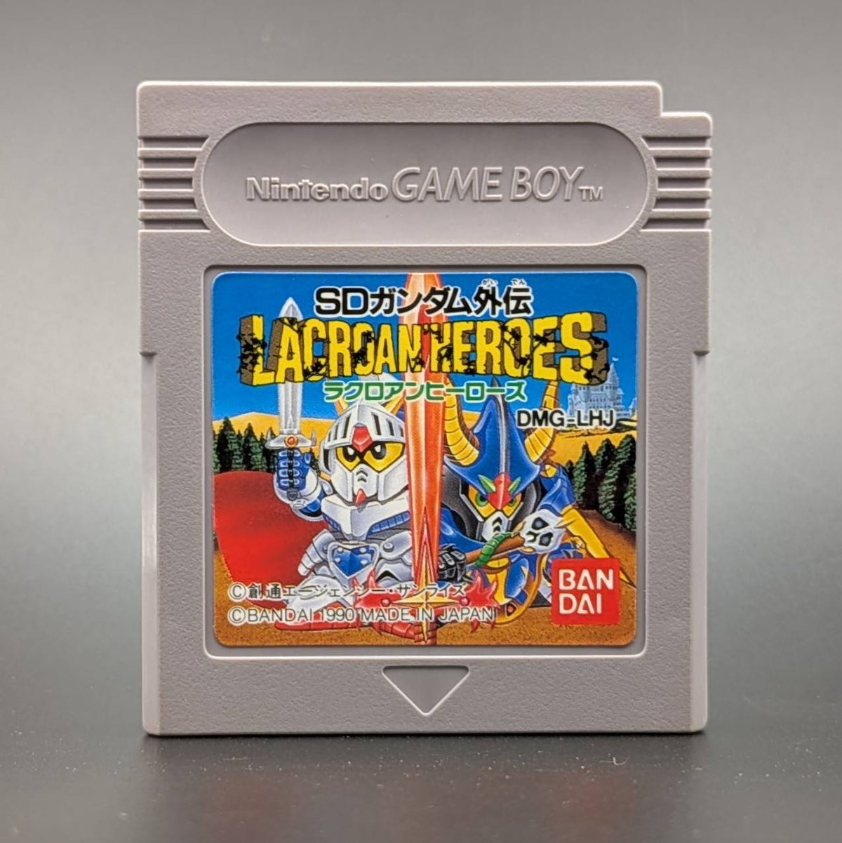 A Nintendo Game Boy cartridge for the game 'SD Gundam Lacroan Heroes' (by Bandai, shown on a neutral gray background.