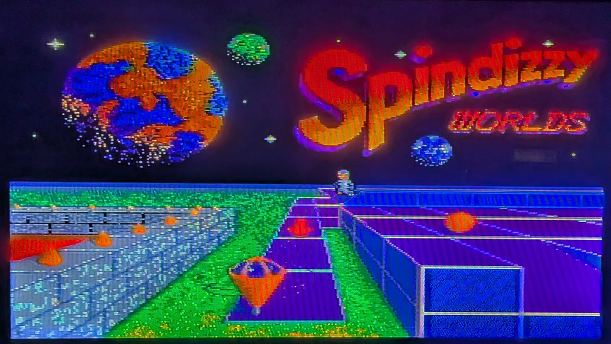 A game title screen game screen for  'Spindizzy Worlds' for  Nintendo's Super Famicom (SFC), with colorful planets, a small character & a spinning top, on a neon purple path way.