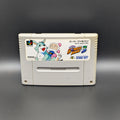 Super Bomberman 3 video game cartridge for Nintendo's Super Famicom (SFC) Entertainment System, shown standing up and facing forwards on a dark grey background.