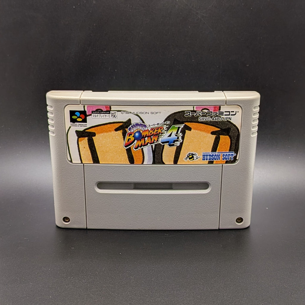 Super Bomberman 4 video game cartridge for Nintendo's Super Famicom (SFC) Entertainment System, shown standing up and facing forward on a dark grey background.
