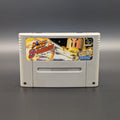 Super Bomberman B-Daman video game cartridge for Nintendo's Super Famicom (SFC) Entertainment System, shown standing up and facing forward on a dark grey background.
