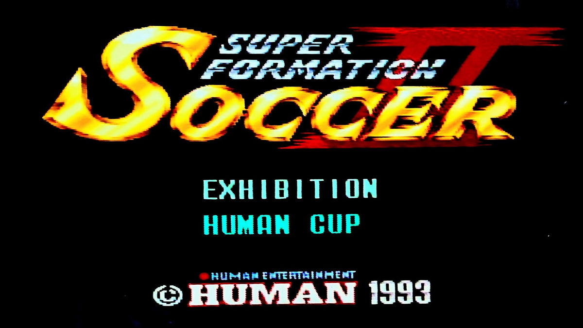 Vintage video game title screen for Super Formation Soccer II, featuring large stylized yellow and red lettering on a black background, with Human Entertainment branding at the bottom.
