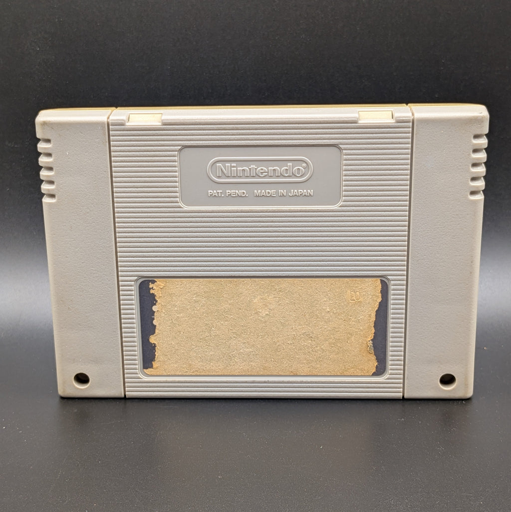 Super Momotarou Dentetsu 3 video game cartridge for Nintendo's Super Famicom (SFC) Entertainment System, showing the back of the cartridge. It sits on a dark grey background. The back label is damaged/missing.