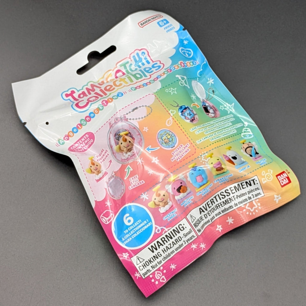 A sealed toy packaging bag for a Bandai Namco 'Tamagotchi collectibles', featuring a colourful pastel gradient design with character illustrations and product examples, photographed on a neutral grey background.