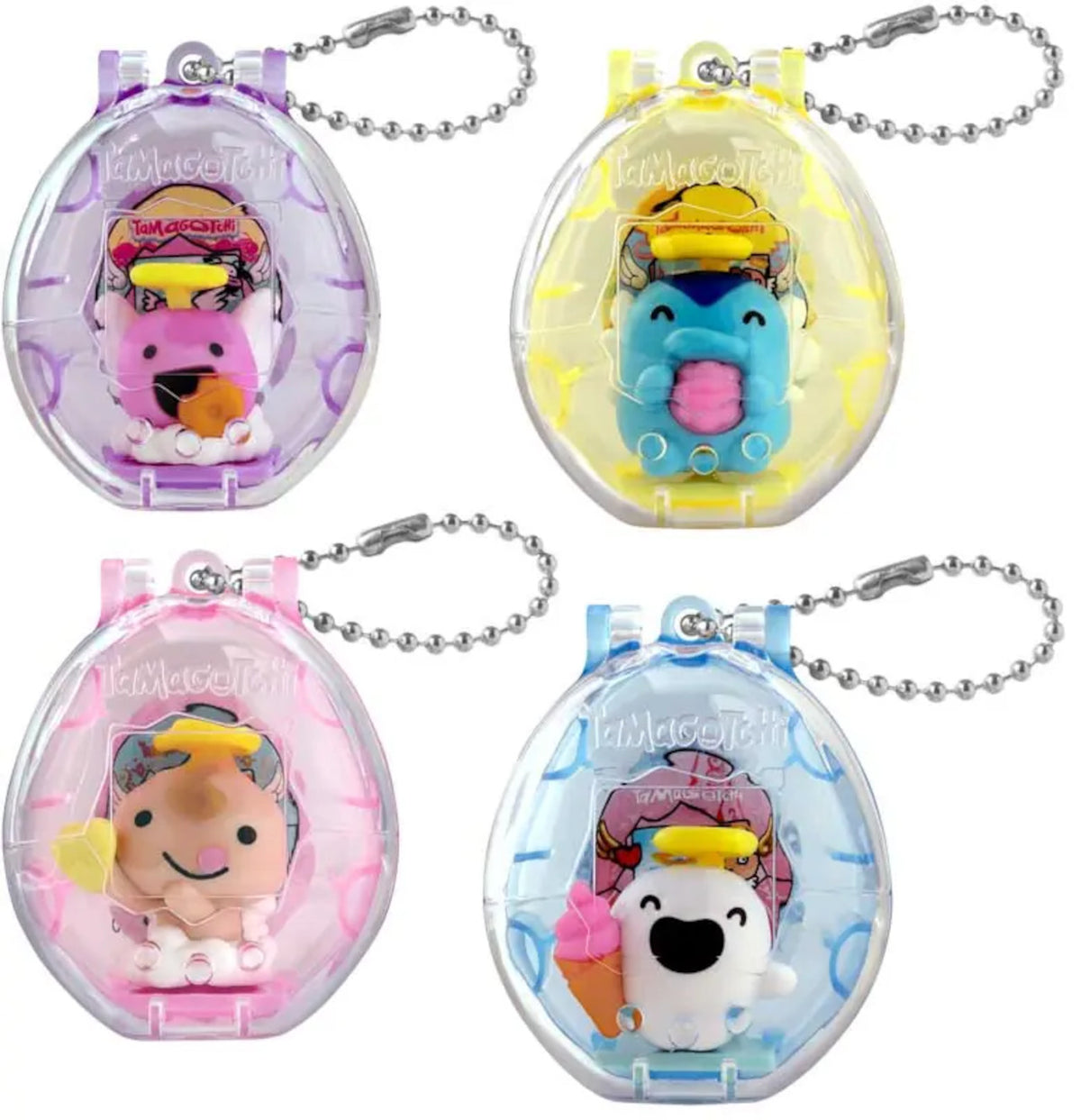 Four small plastic egg-shaped keychain toys with metal ball chains, shown in separate colour variants: purple, yellow, pink, and blue. Each Tamagotchi egg contains a small cartoon figure character with accessories.