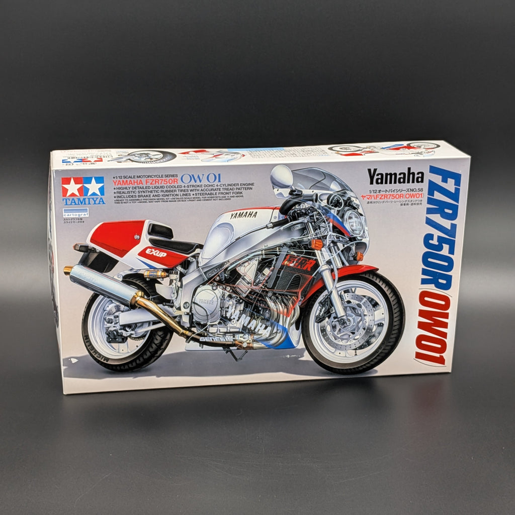 Tamiya model kit box for a Yamaha FZR750R Owo1 motorcycle, featuring a detailed illustration of the motorcycle on the front of the packaging.