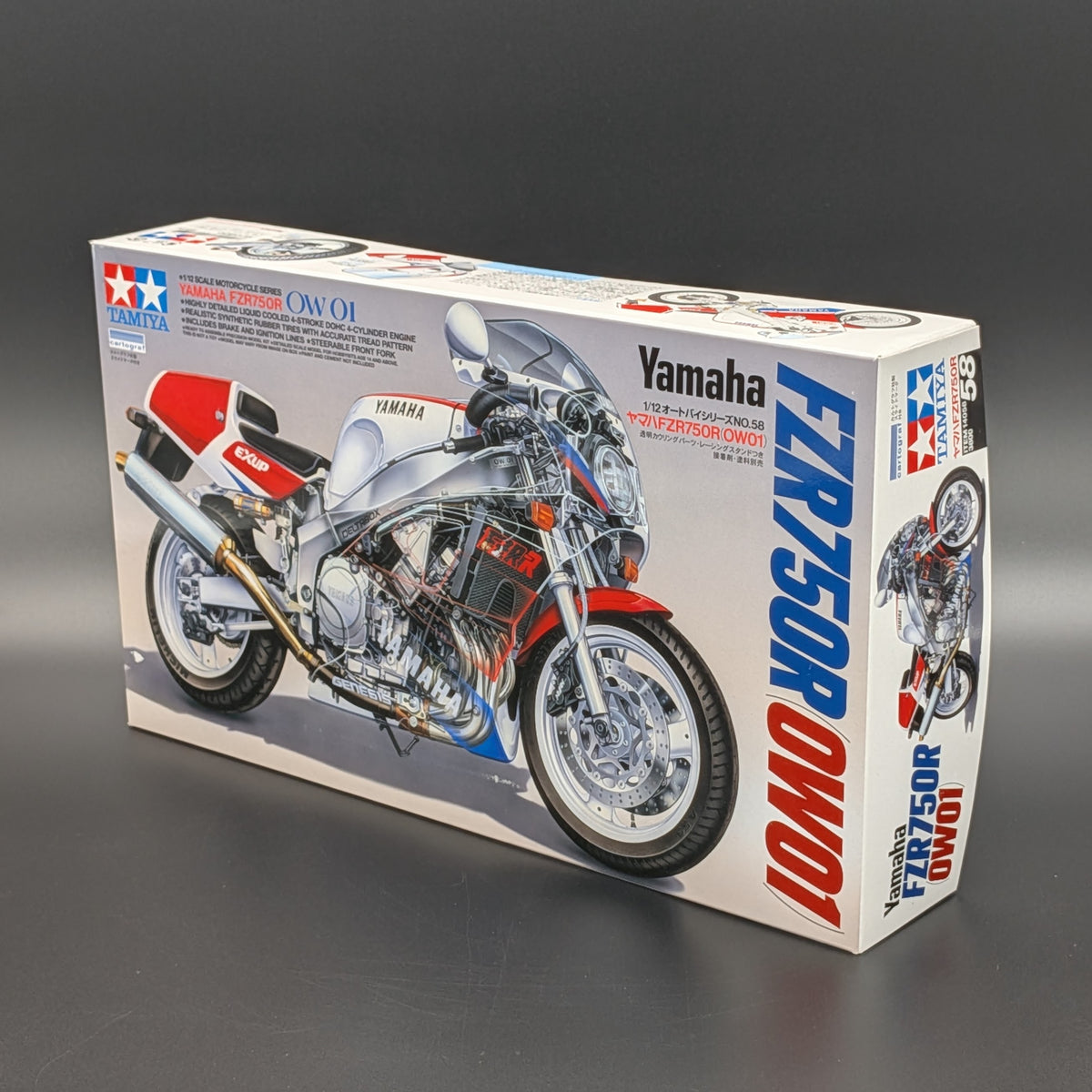 Tamiya model kit box for Yamaha FZR 750 R OW-01, showing a detailed illustration of the motorcycle on a white and gray box with blue and red text.