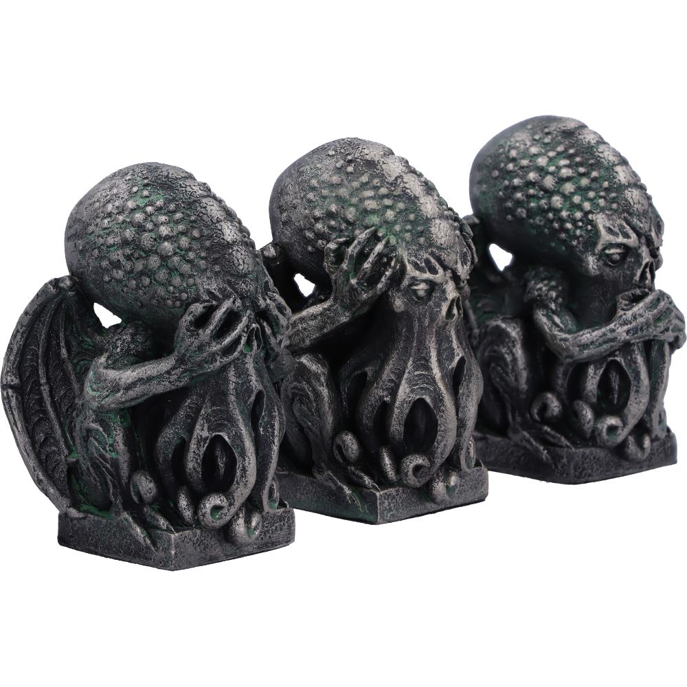 Three dark grey Cthulhu figures on a white background