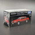 A boxed Tomica Premium Takara Tomy Toyota Corolla Levin model car, number 25, in its original shrink-wrapped packaging on a dark gray background.