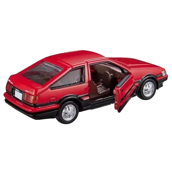 A red die-cast model car with its front door open, showing a brown interior, photographed on a plain white background.