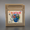A vintage Nintendo Game Boy game cartridge for the Japanese market, . The cartridge is a tan plastic with a colourful label.