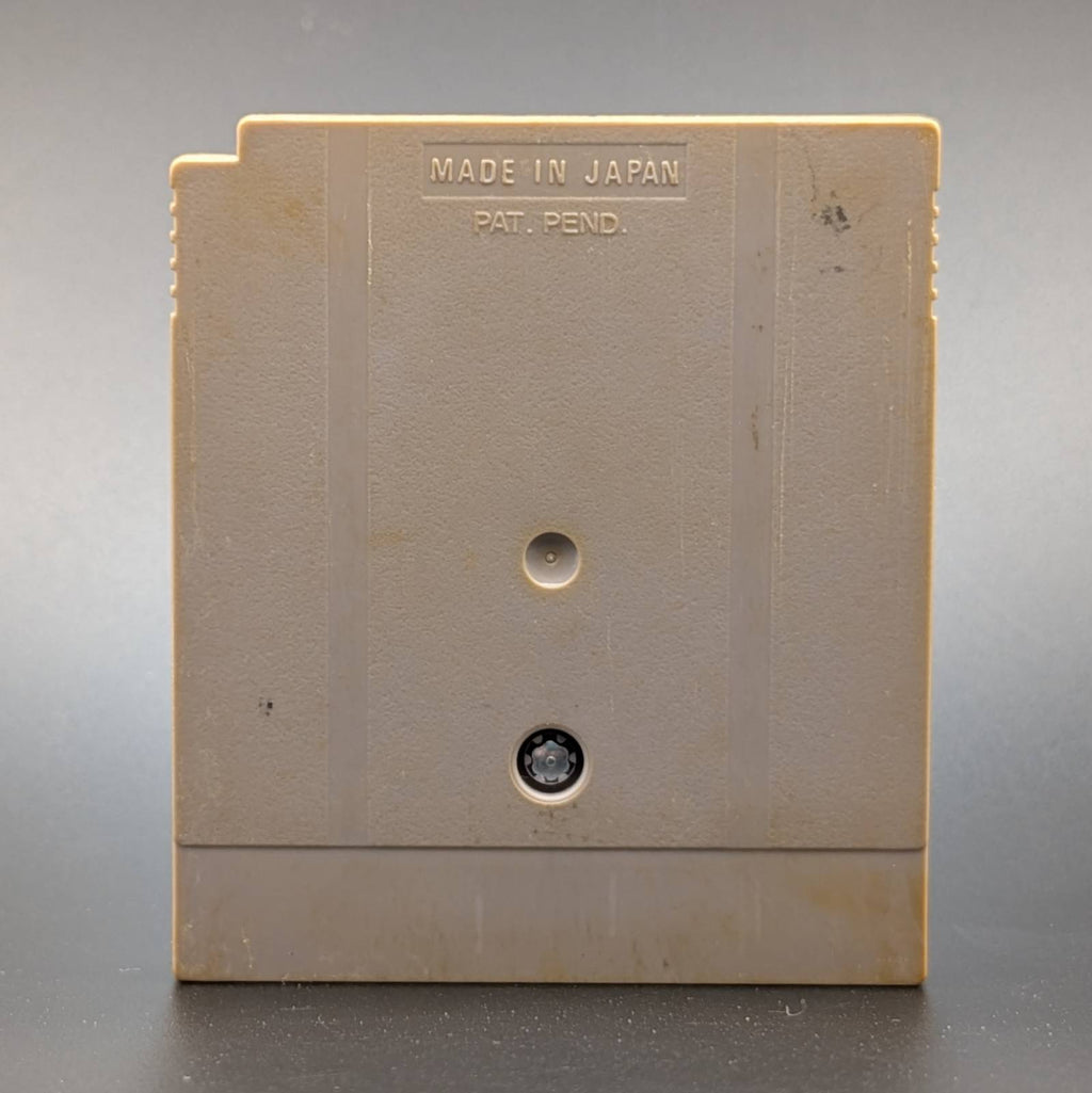 A vintage beige plastic Game Boy Cartridge shown from the back, featuring 'MADE IN JAPAN' and 'PAT. PEND.