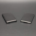 Black rectangular iPod back plates, shown from the back on a dark gray textured surface.