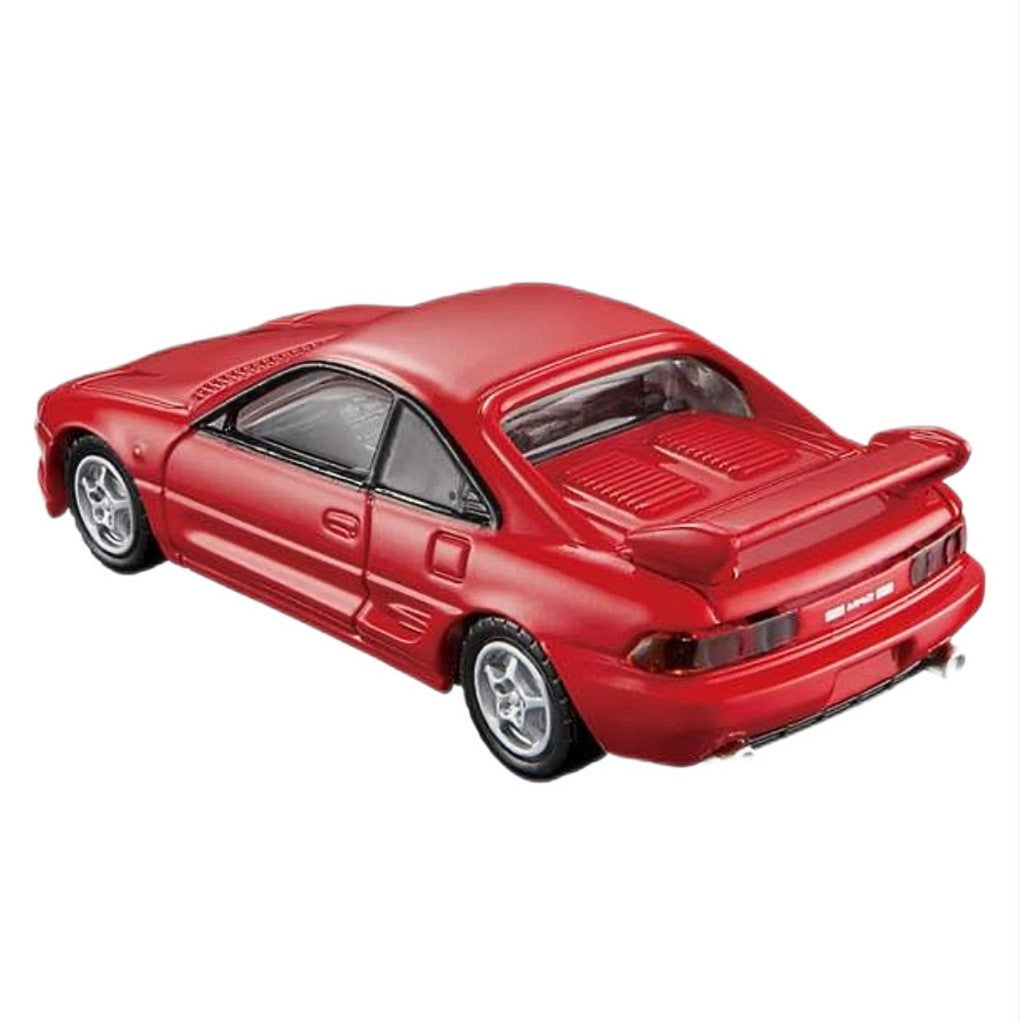 A red toy model car with a rear spoiler, black tires, and silver rims, shown from a three-quarters rear angle on a plain white background.